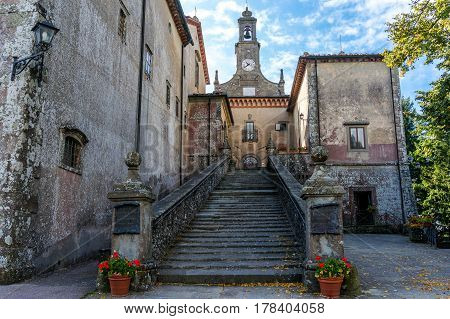 Old Monastery Building With Staircase And Tower Clock