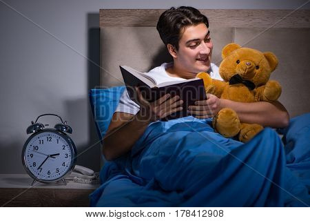 Young man sleeping in the bed