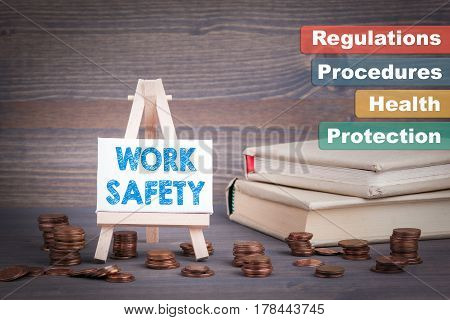 Work Safety Business Concept. Miniature easel with small change.