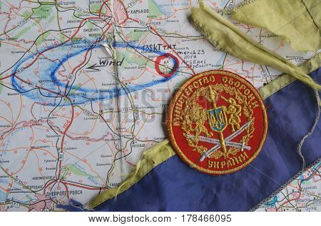 Chevron of Ukraine army.Back-Map of Ukraine  with location of Balakleya .Place of arsenal explosion at 23 march. 138 kT. of TNT power.March 23 ,2017 in Kiev, Ukraine