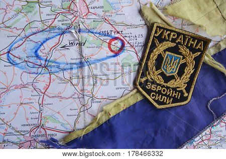 Chevron of Ukraine army.Back-Map of Ukraine  with location of Balakleya .Place of arsenal explosion at 23 march. 138 kT. of TNT power.March 23 ,2017 in Kiev, Ukraine