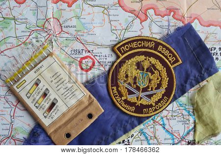 Chevron of Ukraine army.Back-Map of Ukraine  with location of Balakleya .Place of arsenal explosion at 23 march. 138 kT. of TNT power.March 23 ,2017 in Kiev, Ukraine