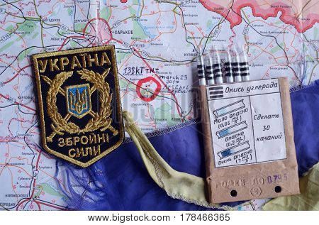 Chevron of Ukraine army.Back-Map of Ukraine  with location of Balakleya .Place of arsenal explosion at 23 march. 138 kT. of TNT power.March 23 ,2017 in Kiev, Ukraine