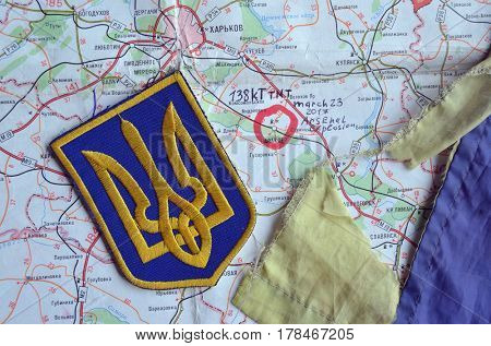 Chevron of Ukraine army.Back-Map of Ukraine  with location of Balakleya .Place of arsenal explosion at 23 march. 138 kT. of TNT power.March 23 ,2017 in Kiev, Ukraine