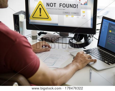 Man working on computer network graphic overlay