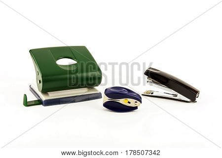 Stationery - Stapler anti-stapler and puncher on a light background
