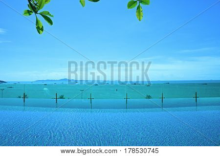 relax at swimming pool with blue sky and island view