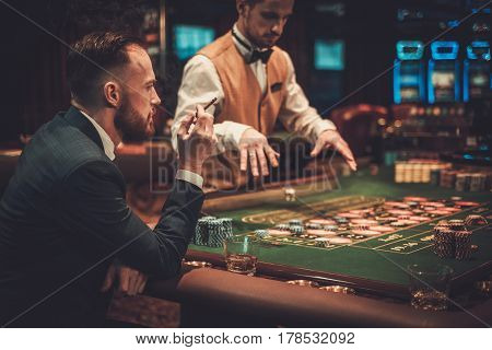 Upper class man gambling in a casino