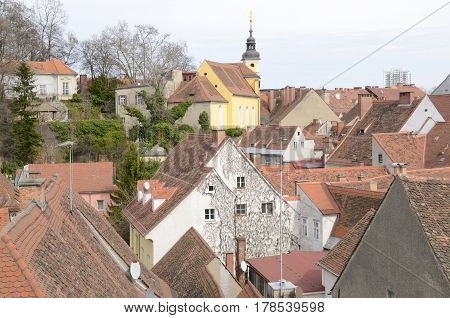 View of tower and roofs of the city from the terrace of the Kastner and Ohler warehouses in Graz the capital of federal state of Styria Austria.