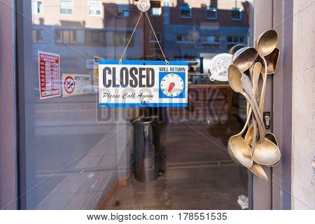MILAN ITALY - September 12 2016:Unusual cafe's door handle made from vintage ladles and retro spoons and the sign with the inscription 