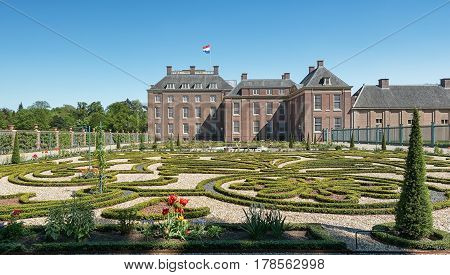 Apeldoorn The Netherlands May 8 2016: Dutch baroque garden of The Loo Palace a former royal palace and now a national museum located in the outskirts of Apeldoorn in the Netherlands