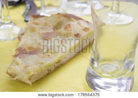 homemade crostino pizza with mozzarella and cured ham