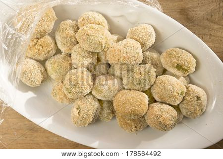 preparing stuffed fried olives called Ascolana olives