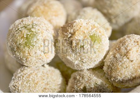 preparing stuffed fried olives called Ascolana olives