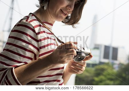 Woman traveler photographer holiday lifestyle trip
