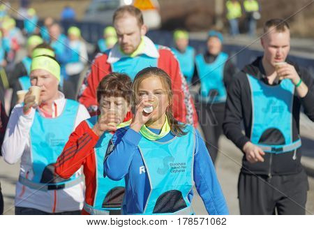 STOCKHOLM SWEDEN - MAR 25 2017: Group of runners drinking water in the Stockholm Tunnel Run Citybanan 2017. March 25 2017 in Stockholm Sweden