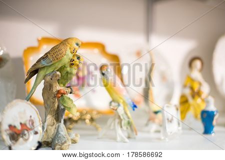 Parrot couple porcelain figurine In the shop window
