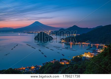View of Mount Fuji with Suruga bay and Numazu town in twilight time