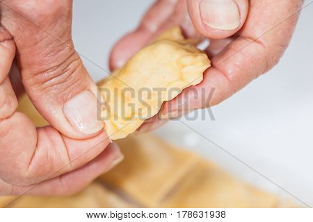 Ravioli Preparation : Sealing and decorating raw cut ravioli edge