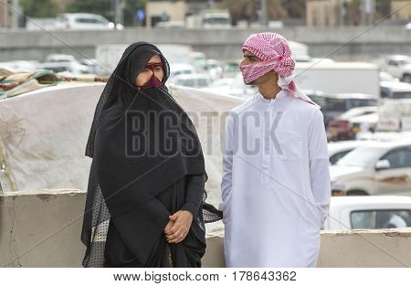Nizwa Oma 24th March 2017: omani couple talking at the Nizwa market