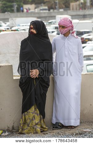 Nizwa Oma 24th March 2017: omani couple talking at the Nizwa market