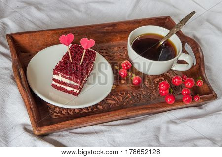 Breakfast in bed. Cup coffee red velvet cake.
