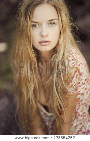Portrait of a blonde girl with green eyes a mermaid