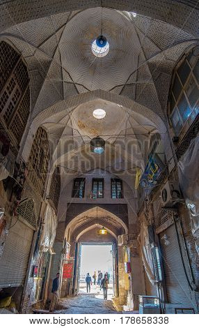 Isfahan, Iran - Circa February 2016 - A perspective interior shot of a bazaar overlooking Naqsh-e Jahan Square in Isfahan, Iran which was under renovation at the time