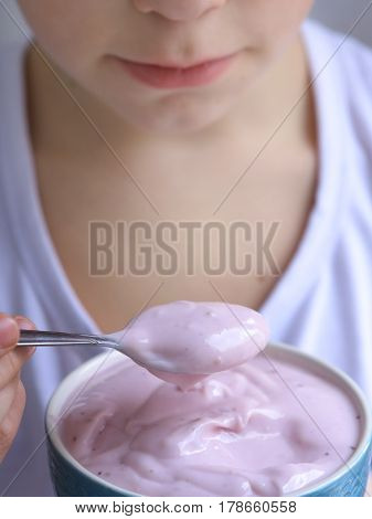 Teenager Boy Eating Yogurt