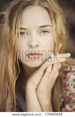 Portrait of a blonde girl with green eyes a mermaid
