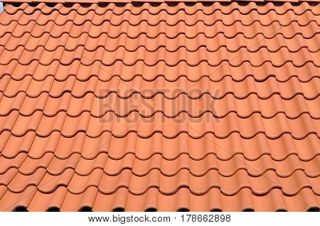 red tiled roof on the house as a background