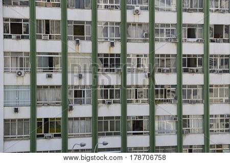 Facade of old building in the neighborhood of copacabana with several types of air-conditioned the show in bad condition.