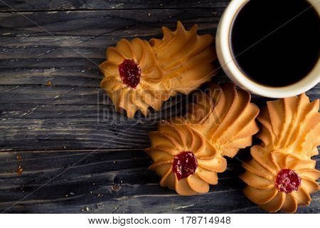 Cookies kurabe on a wooden table in a rustic style.