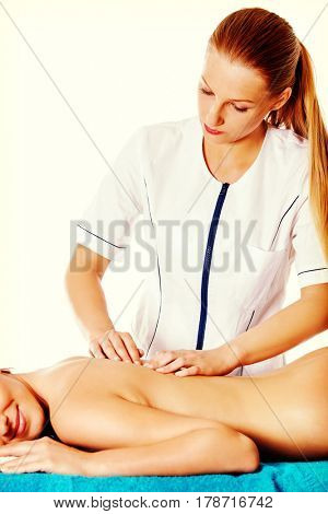 Woman having massage of body in the spa salon. Beauty treatment concept.