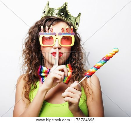 Young woman having fun. Young pretty woman with crown is laughin