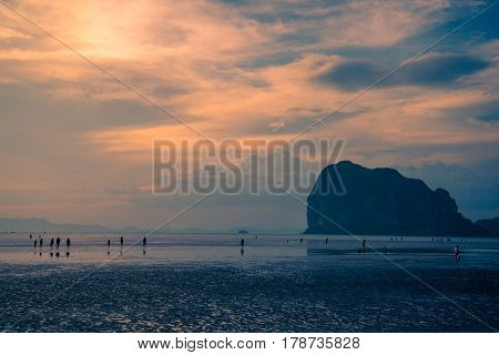 Many travelers on beautiful beach in sunset at TrangThailand.