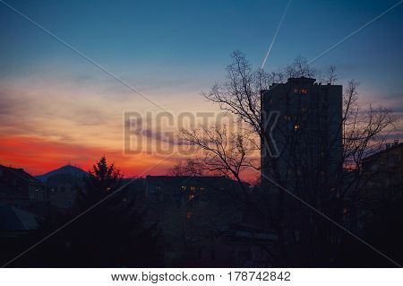 Sunset over a small Balkan town early spring season Cacak city in Serbia.