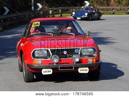 Mignanego Italy - September 25th 2015 - Reenactment 18th Pontedecimo Giovi: The Lancia Fulvia Sport 1972 conducted by snack-snack during a timed regularity 'test.
