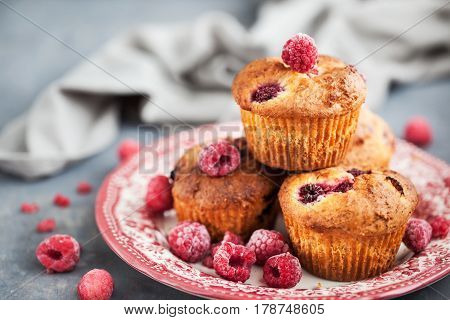 Fresh homemade delicious raspberry muffins on plate