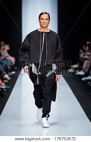 MOSCOW RUSSIA - MARCH 15 2017: Model walk runway for DESIGNER NIKOLAY LEGENDA catwalk at Fall-Winter 2017-2018 at Mercedes-Benz Fashion Week Russia. Men's fashion.