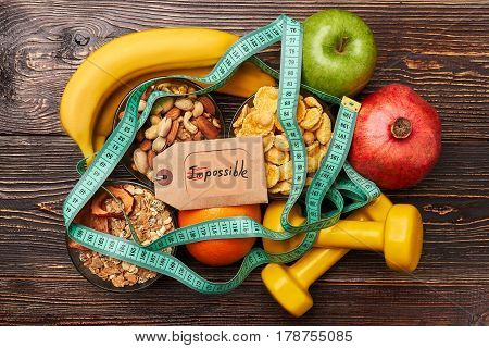 Fruits, cereals and sport equiment. Success comes to persevering.