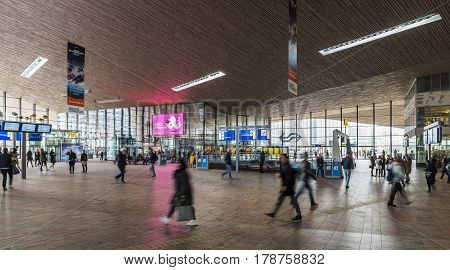 Rotterdam The Netherlands - March 10 2017: Travelers walking in the hall of the railway station of Rotterdam in the Netheralnds.
