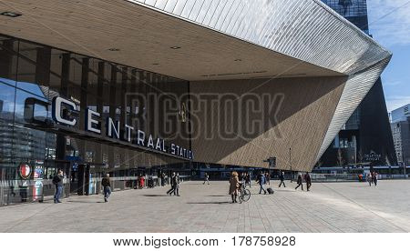 Rotterdam The Netherlands - March 10 2017: Modern railway station by architect MVSA in Rotterdam with square and travelers in the Netherlands.