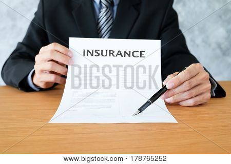 Insurance Policy And Policyholder Must To Sign.