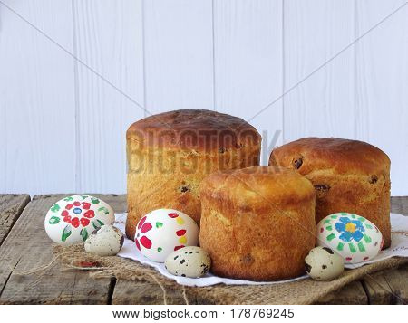 Easter Composition Of Sweet Bread, Paska And Eggs On Wooden Background. Orthodox Kulich. Holidays Br