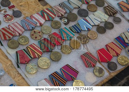 Kiev Ukraine - June 04 2016: Various medals of the Soviet era on the flea market counter on Andreevsky Spusk
