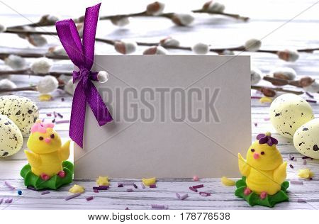 Easter Background With Yellow Easter Eggs Pussy Willow Branches Purple Ribbon And Little Chickens Sp