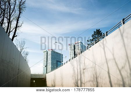 BUCHAREST; ROMANIA - APR 1; 2016: Driver point of view at the entrance of he Pasajul Casa Presei and skyscraper office buildings in the business district of Bucharest