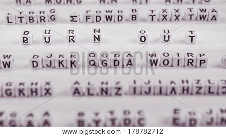 Burn out letters between other blurred lettters.