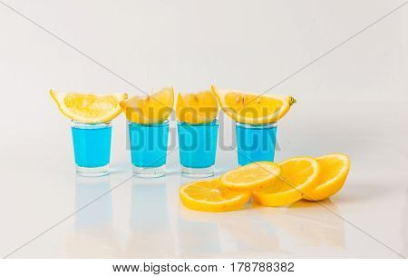 Four Glasses Of Blue Kamikaze, Glamorous Drink, Mixed Drink Poured Into Shot Glasses, Party Set